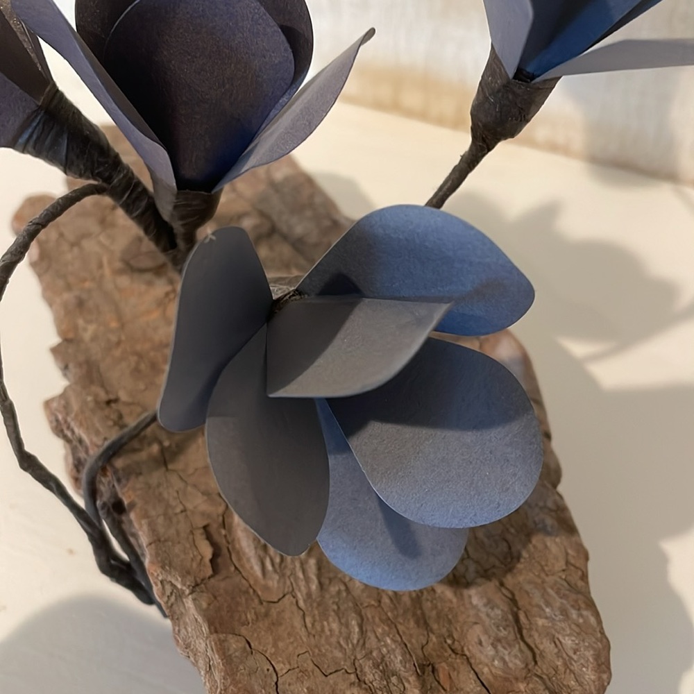 Decorative Piece with distressed wood and paper flowers.